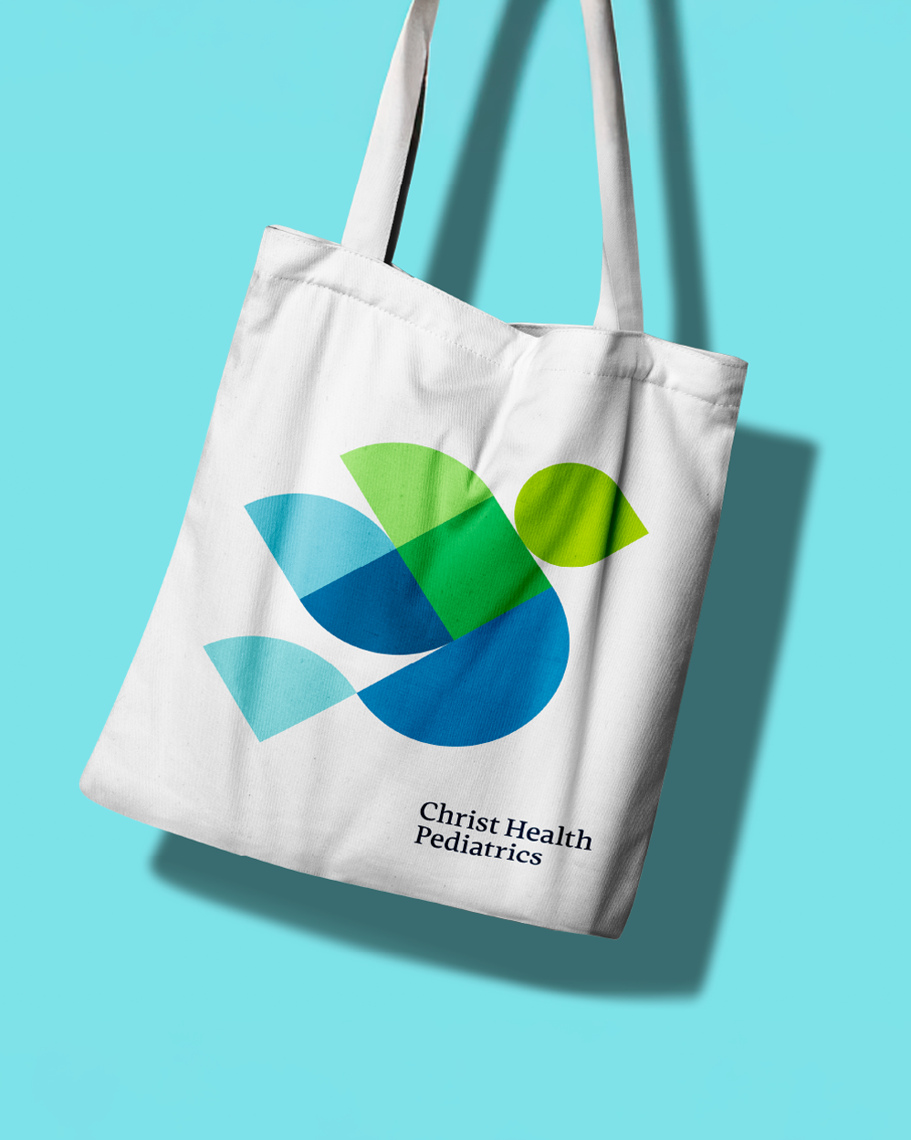 Christ Healt Pediatrics tote mosaic bird logo.